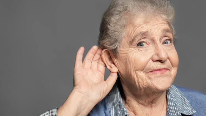Elderly woman with hearing problem
